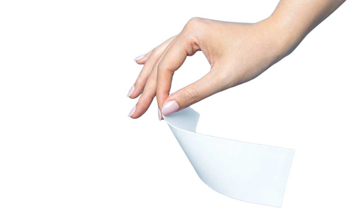 A hand holding a single HeySunday laundry detergent sheet