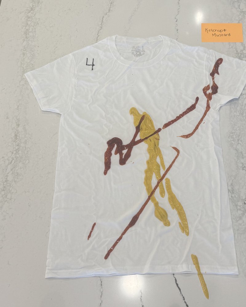 White t-shirt with ketchup and mustard stains — before washing with HeySunday