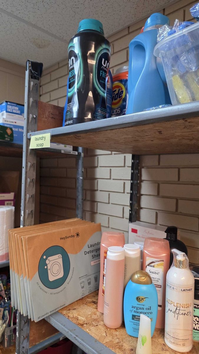 A stocked supply shelf of HeySunday laundry sheet packs at Hope's Door New Beginning Center, Plano, TX